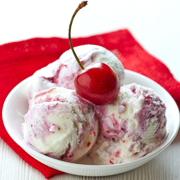 a bowl of cherry vanilla ice cream