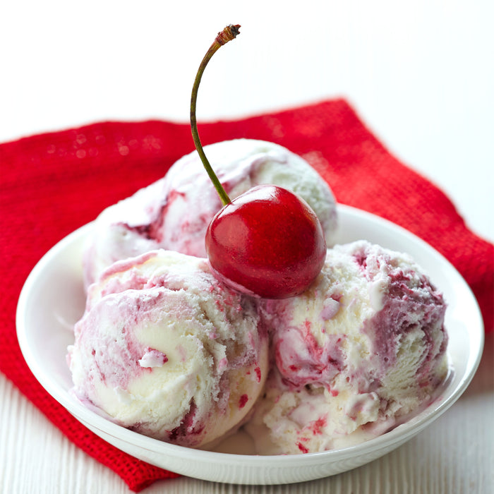a bowl of cherry vanilla ice cream