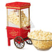 Nostalgia 12-Cup Hot Air Popcorn Maker, red with a bowl of popcorn